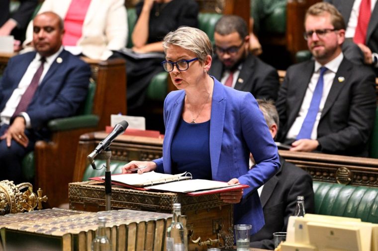 A handout photograph taken and released by the UK Parliament on September 1, 2025 shows Britain's Home Secretary Yvette Cooper delivering a speech on Borders and Asylum in the House of Commons in London. (Photo by House of Commons / AFP) / RESTRICTED TO EDITORIAL USE - MANDATORY CREDIT " AFP PHOTO / House of Commons " - NO USE FOR ENTERTAINMENT, SATIRICAL, MARKETING OR ADVERTISING CAMPAIGNS - EDITORS NOTE THE IMAGE MAY HAVE BEEN DIGITALLY ALTERED AT SOURCE TO OBSCURE VISIBLE DOCUMENTS (Photo by HOUSE OF COMMONS/House of Commons/AFP via Getty Images)