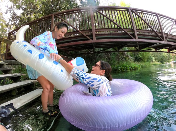 A family jumps in at Rock Springs at Kelly Park in Apopka, Friday, Sept. 12, 2025. Rock Springs is included in a proposed area of Central and North Florida that Florida Congressman Randy Fine wants to be studied as a future national park. In July, Fine proposed the Path to Florida Springs National Park Act. (Joe Burbank/Orlando Sentinel)