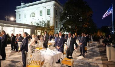Members of Congress listen as President Donald Trump speaks at a dinner in the Rose Garden of the W...
