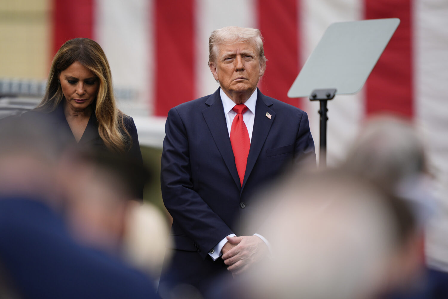 President Donald Trump, right, and first lady Melania Trump attend a ceremony in the Pentagon court...