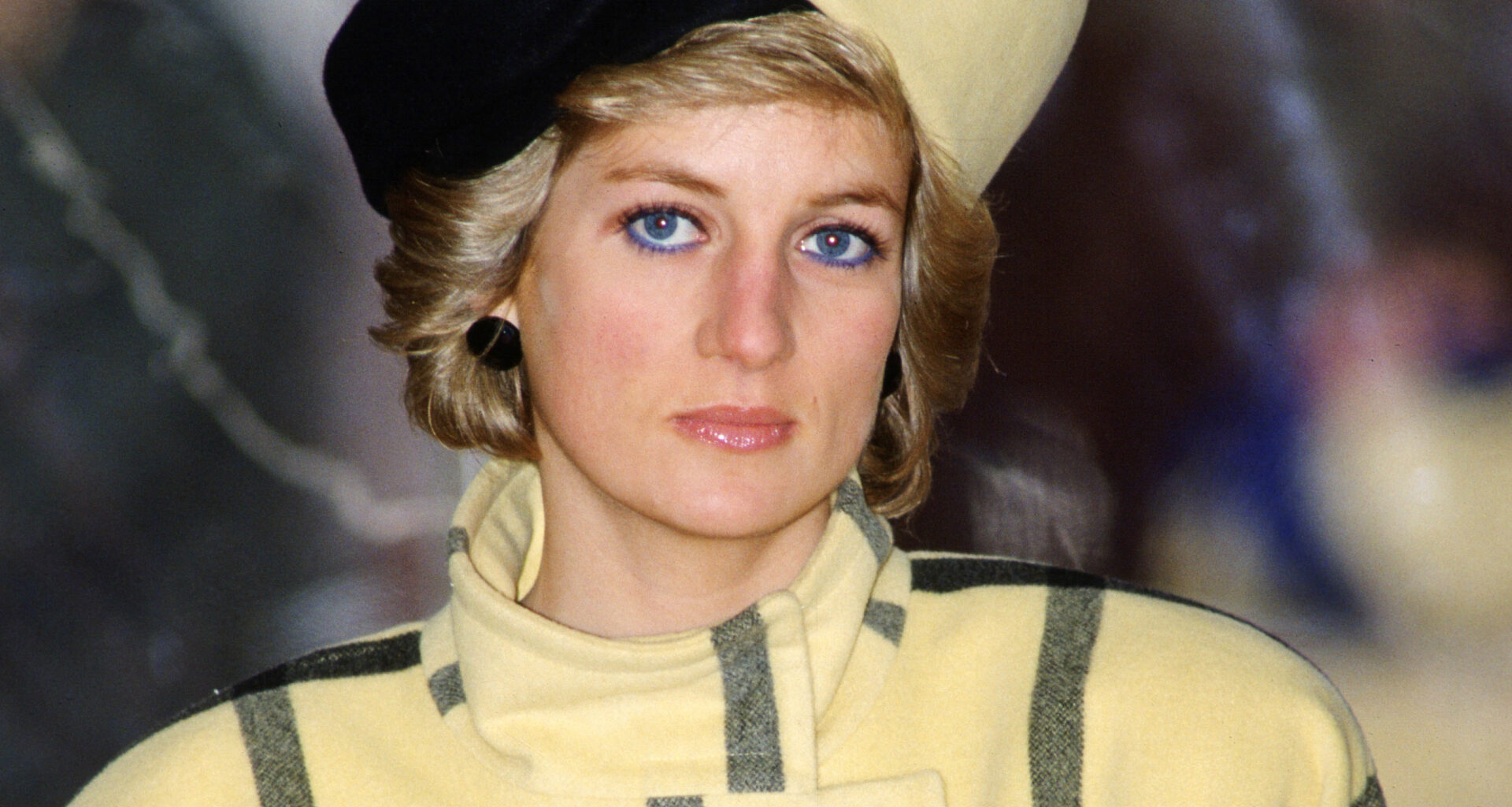Princess Diana visits Cowes on the Isle of Wight to christen the boat Vigilant while wearing a yellow and black checked coat