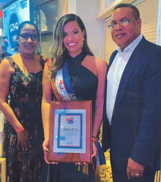 Wendy Garcia holding plaque in undated photo. (Court Documents)