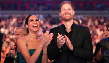 Meghan Markle and Prince Harry clapping and cheering together