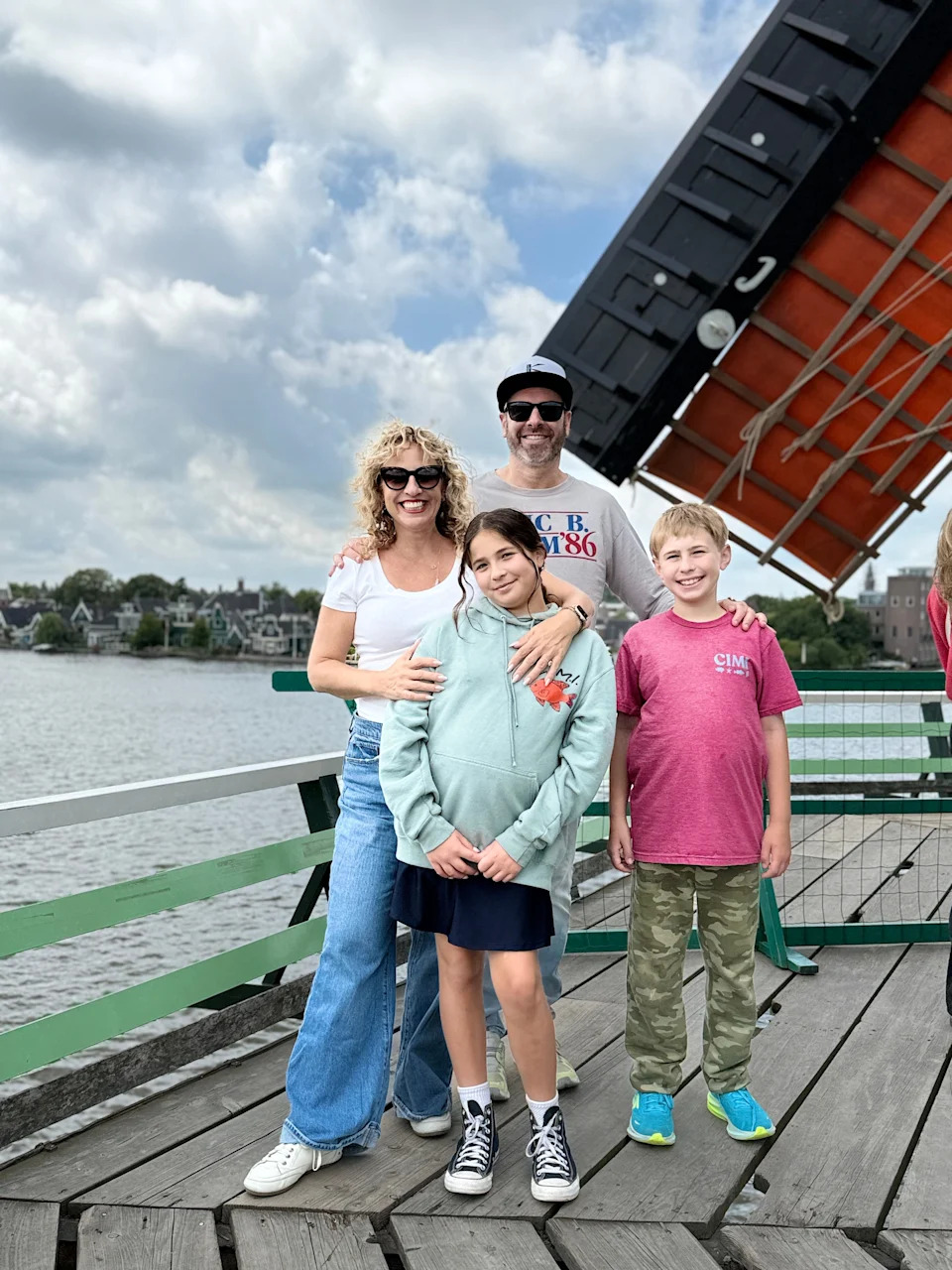 The author and her family near a windmill in Zaanse Schans.
