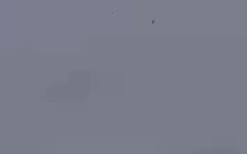 Mobile footage of a Ukrainian interceptor drone destroying a Russian "Lancet" UAV.