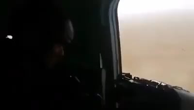 Iraqi army aviation door gunner fires at isis vehicle hidden in the middle of Anbar desert.