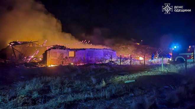 In this photo provided by the Ukrainian Emergency Services on Saturday, Sept. 20, 2025, rescue workers put out a fire of a barn destroyed by a Russian strike in Odesa region, Ukraine. (Ukrainian Emergency Service via AP)