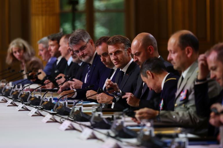 France's President Emmanuel Macron, center, attends a meeting with Ukraine's President Volodymyr Zelenskyy, unseen, at the Elysee Palace, in Paris, France, Wednesday, Sept. 3, 2025. (Teresa Suarez/ Pool Photo via AP)