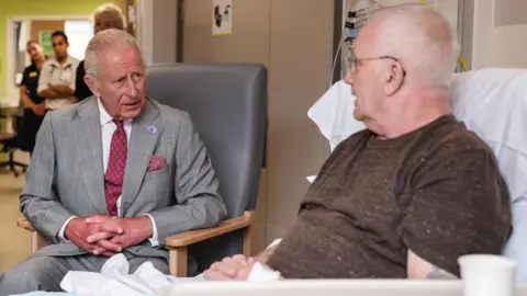 Reuters The King talking to Phillip Barnard about immunotherapy treatment