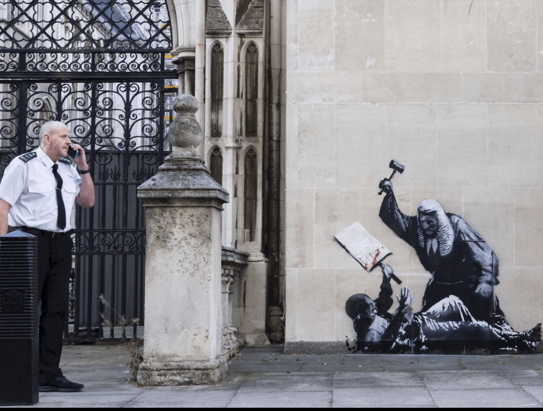 UK immediately covered up new Banksy art, commenting on the arrest of peaceful protest. Would be a shame if it was shown everywhere
