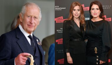 King Charles wearing a blue suit holding a walking stick; Princess Beatrice and Princess Eugenie wearing black dresses on a red carpet