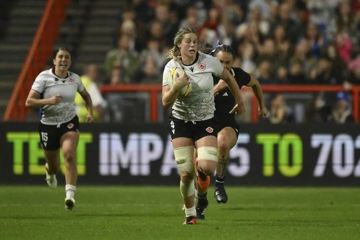 Canada’s Sophie de Goede controls the ball the Women’s Rugby World Cup 2025 semifinal match between New Zealand and Canada in Bristol, England, Friday, Sept. 19, 2025.
