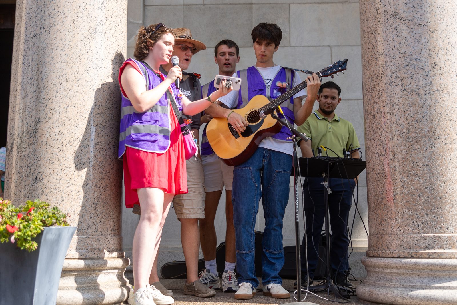 As the procession for the 111th World Day of Migrants and Refugees was about to begin at the Shrine of the Sacred Heart in Washington, D.C., on Sept. 28, 2025, choir members sing “Somos El Cuerpo De Cristo/We Are the Body of Christ.” (Catholic Standard photo by Mihoko Owada)