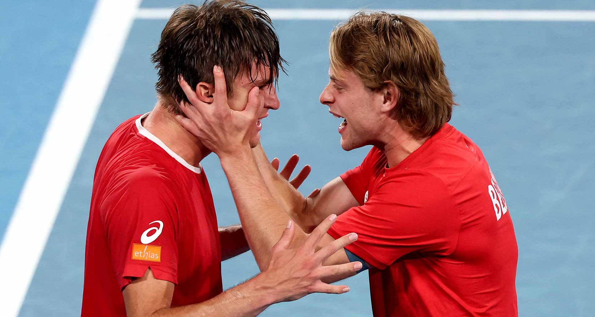 Raphael Collignon is embraced by Zizou Bergs after clinching victory for Belgium on Sunday in Sydney.