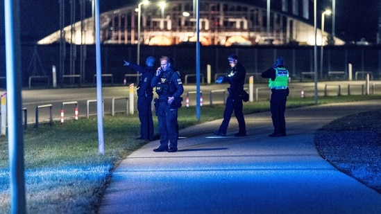 Police officers walk after all traffic has been closed at the Copenhagen Airport due to drone reports in Copenhagen, Denmark (via REUTERS)