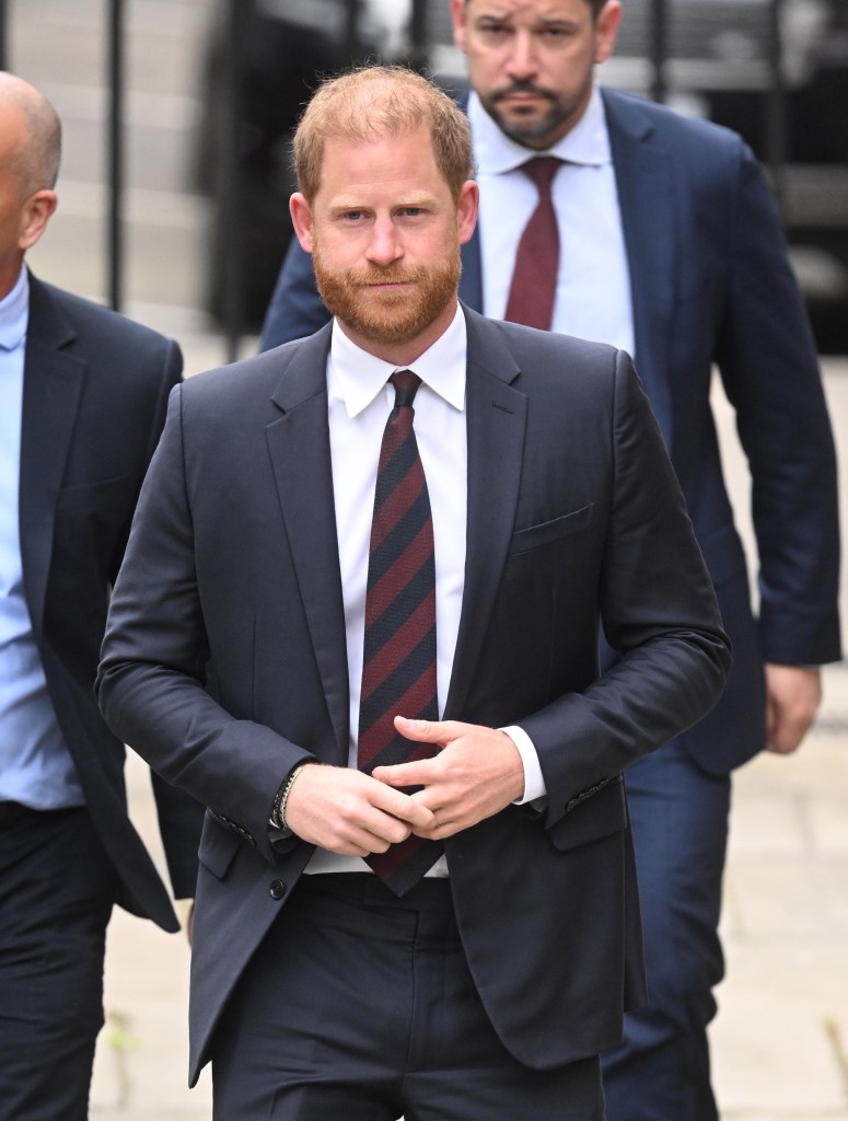 Prince Harry in suit leaving UK court