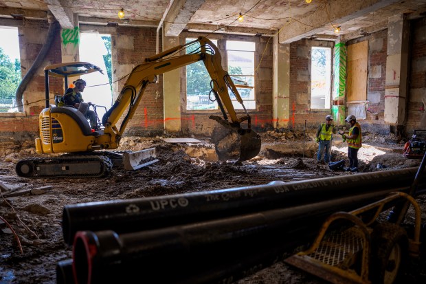 An excavator works on the ground floor of the 1951 Constitution Avenue Building as renovations continue on the Federal Reserve on July 24, 2025, in Washington. (Andrew Harnik/Getty)