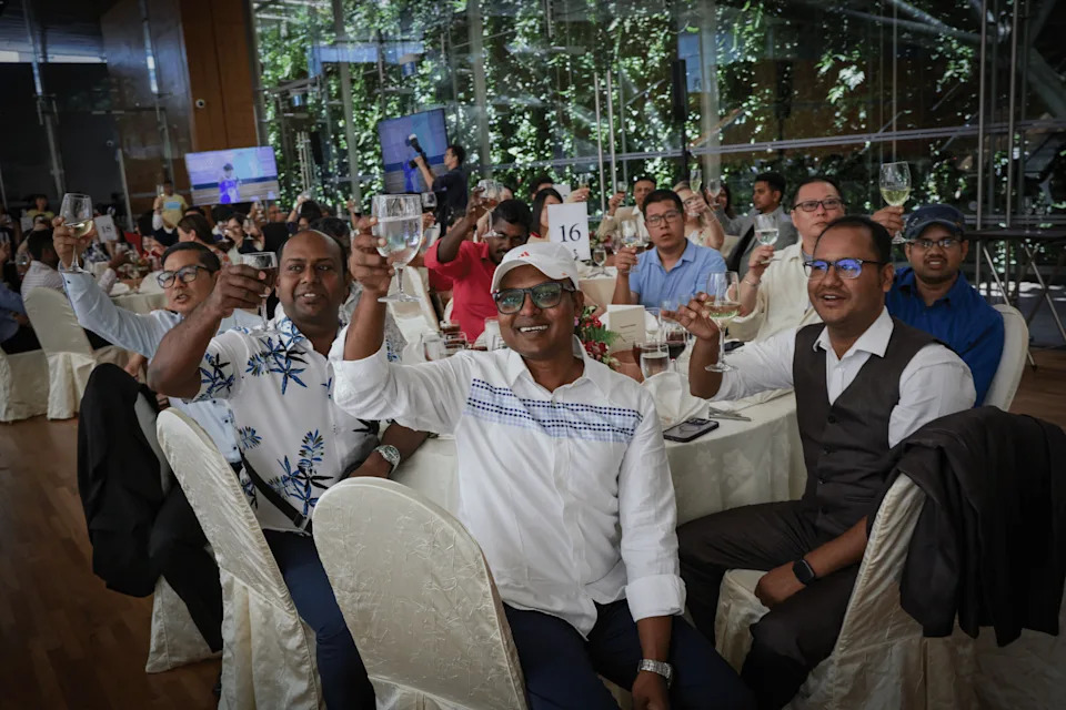 Migrant workers and attendees cheering at ItsRainingRaincoats’s 10th anniversary on Sept 21.
