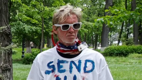 Reuters Ryan Routh, wearing white sunglasses and a neckerchief in the colours of the American flag 