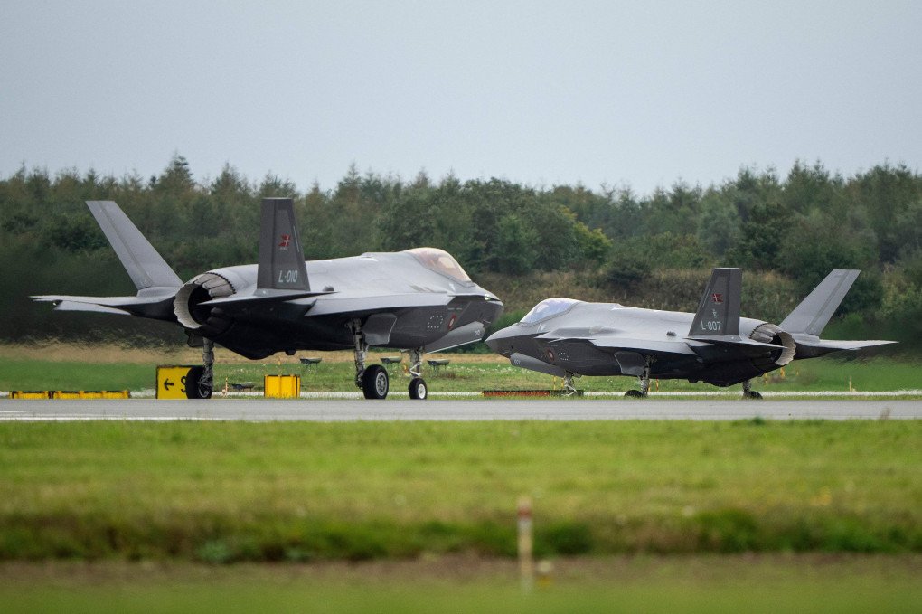 Two F-35 fighter jets are pictured at Fighter Wing Skrydstrup air base of the Royal Danish Air Force (RDAF) after patrolling around Denmark at low altitude near Skrydstrup, Denmark on October 1, 2023. (Source: Getty Images)