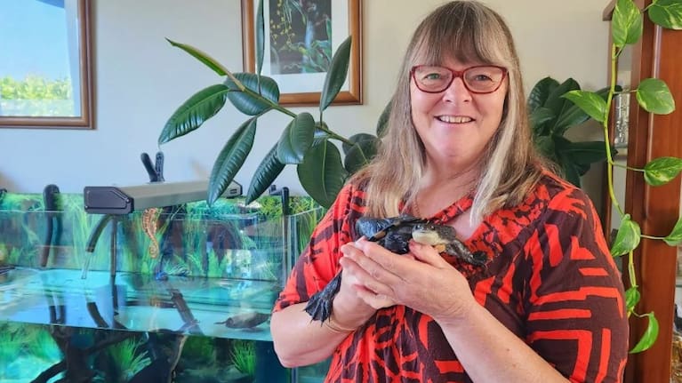 Donna Moot pictured with a turtle.