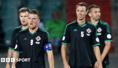 Steven Davis and Jonny Evans look dejected after Northern Ireland's 2013 defeat by Luxembourg