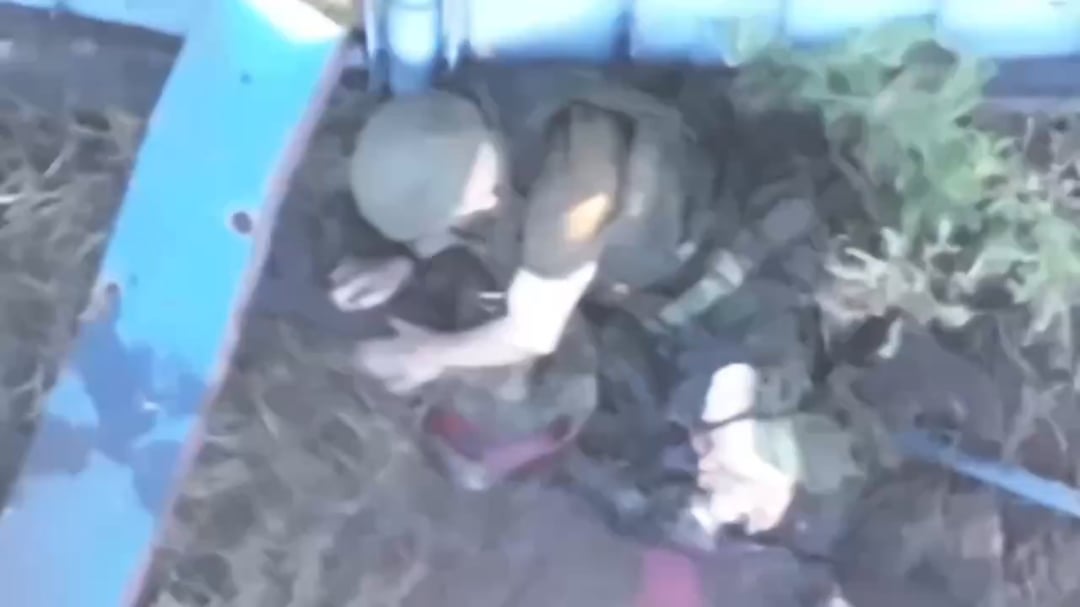 NSFW. A russian assault trooper loses both legs to a drone drop near Vovchansk. He appears to search for a turniquet, gives up and shoots himself in the head instead. Ares group, 57th Brigade. September 2025.