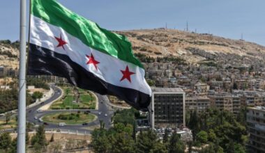 The largest Syrian flag of 600 square meters is hoisted on the tallest pole, 110 meters high, in Tishreen Park of the Syrian capital Damascus, June 4, 2025. (AA Photo)