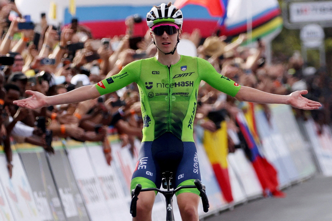 Flamboyant Pogacar retains world title to cement legacy