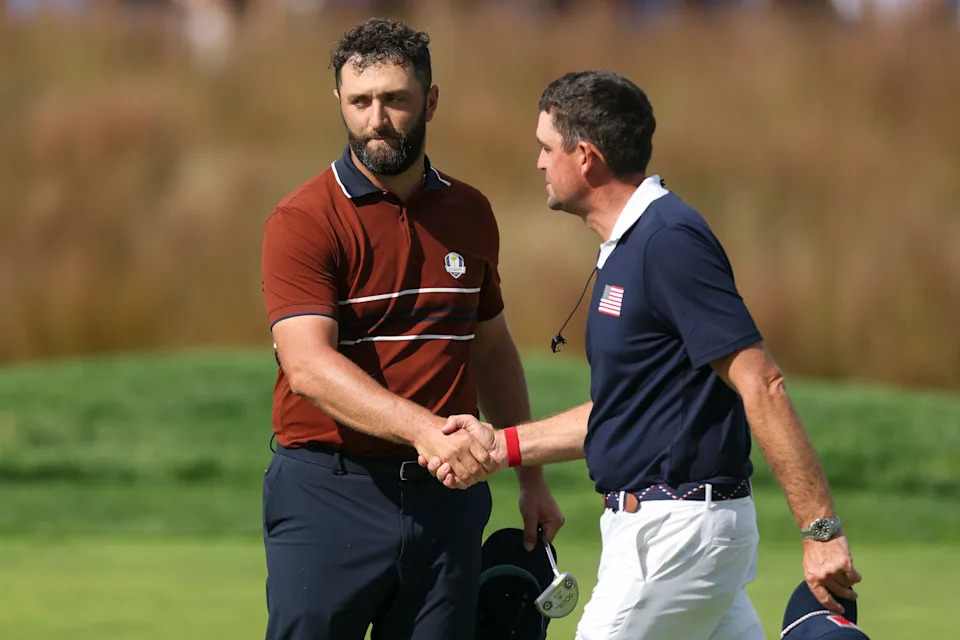 FARMINGDALE, NEW YORK - SEPTEMBER 27: Jon Rahm of Team Europe and captain Keegan Bradley of Team United States shake hands after Rahm and Tyrrell Hatton of Team Europe defeated Xander Schauffele and Patrick Cantlay of Team United States 3&2 during the Saturday morning foursomes matches of the 2025 Ryder Cup at Black Course at Bethpage State Park Golf Course on September 27, 2025 in Farmingdale, New York. (Photo by Carl Recine/Getty Images)