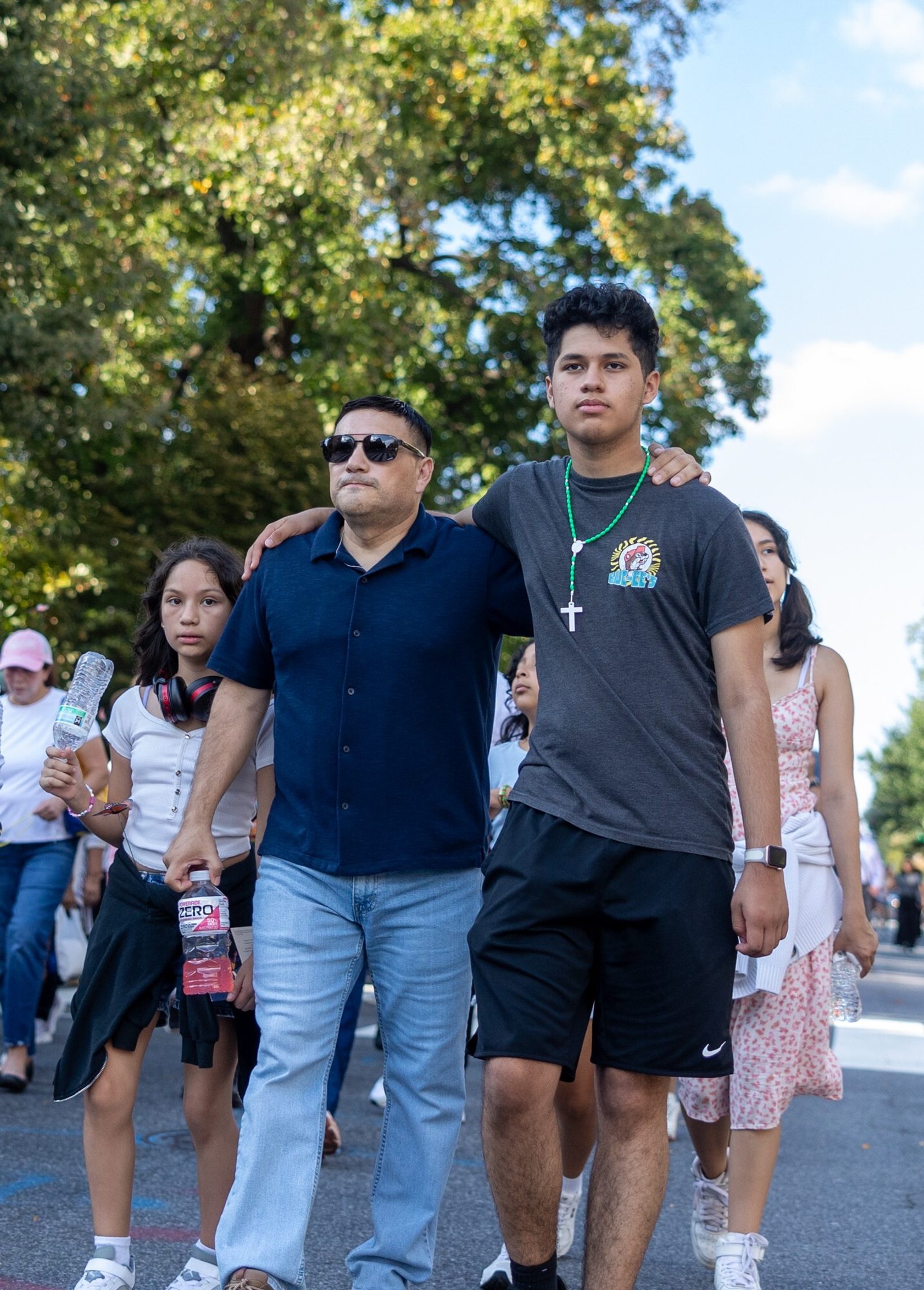 Family members walk in a procession for the 111th World Day of Migrants and Refugees on Sept. 28, 2025 that began at the Shrine of the Sacred Heart in Washington, D.C., wound down 16th Street, and concluded at the Cathedral of St. Matthew the Apostle. (Catholic Standard photos by Mihoko Owada)