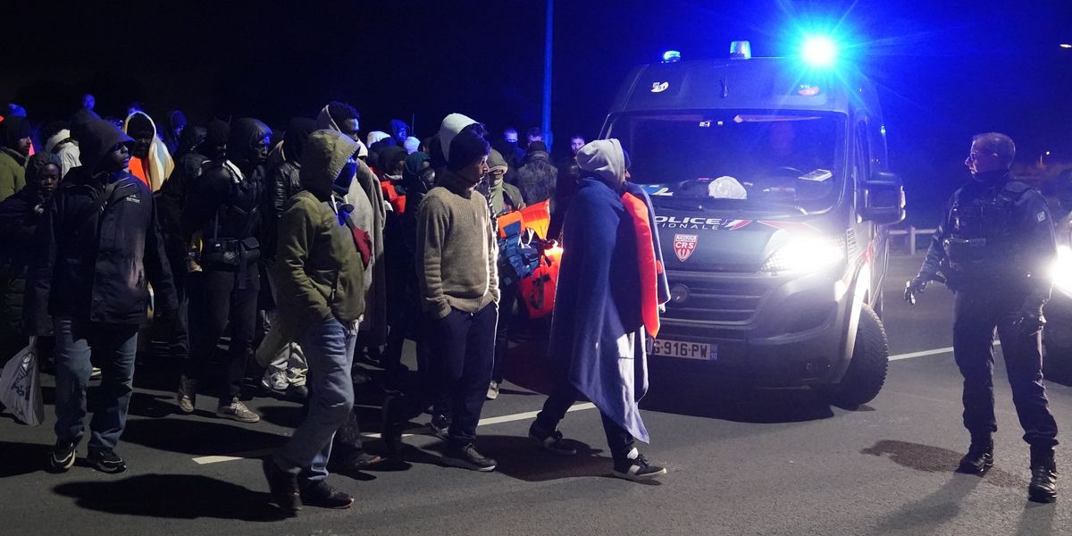 French riot police block dozens of asylum seekers from reaching small boats in early hours confrontation