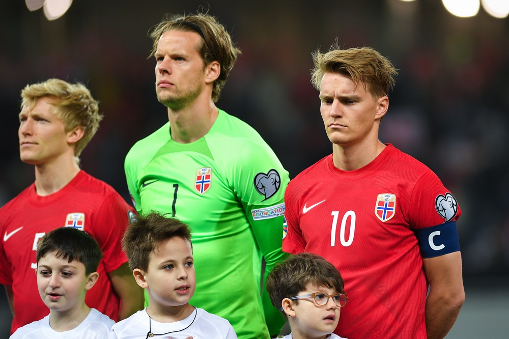 BATUMI, GEORGIA: Birger Meling, Orjan Nyland and Martin Odegaard, the captain of Norway, stand for the anthems during the UEFA EURO 2024 qualifying round group A match between Georgia and Norway at Batumi Stadium on March 28, 2023. (Photo by Levan Verdzeuli/Getty Images)