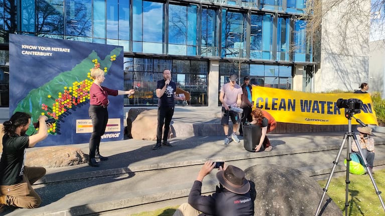 Greenpeace freshwater campaigner Will Appelbe addresses the crowd outside the Environment Canterbury building.