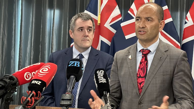 Housing Minister Chris Bishop and Associate Housing Minister Tama Potaka speak at a media conference on Friday.