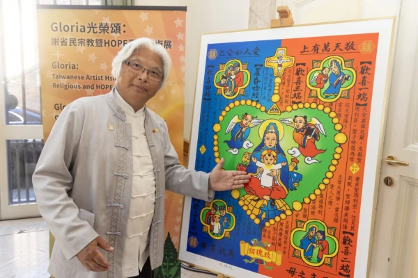 Catholic artist Hsieh Sheng-Min points out details in his depiction of the joyful mysteries of the rosary during an interview with CNA at the opening of his art exhibition at the Pontifical Urbaniana University in Rome. Credit: Embassy of the Republic China to the Holy See