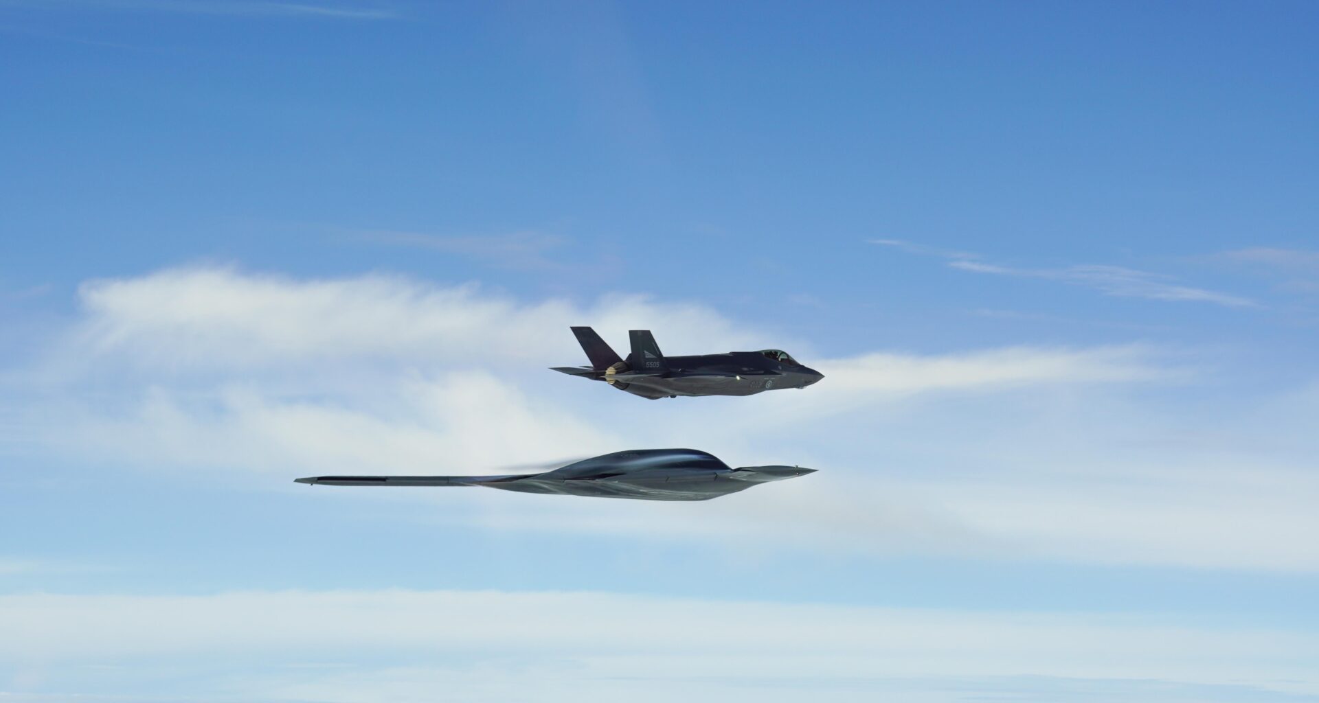 A B-2A Spirit strategic bomber in formation with a RNoAF F-35A Lightning IIs over the Norwegian Sea, September 3.
