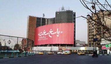 Vali-Asr Square, Tehran — A giant billboard reading “Hard Response” looms over the city center, June 14, 2025