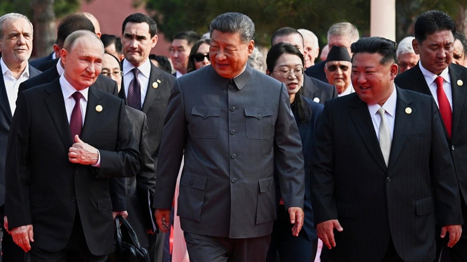 Trump says China conspiring against US with Putin, Kim meeting at military parade