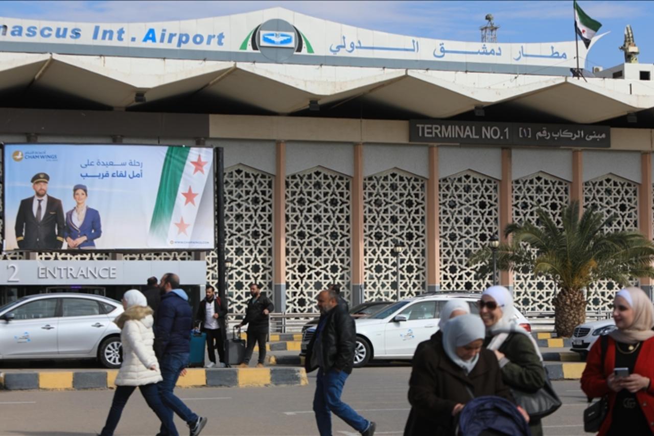 DAMASCUS, SYRIA - JANUARY 23: Syrians celebrate landing at Damascus International Airport as Turkish Airlines operates its first flight to Syria after 13 years in Damascus, Syria, January 23, 2025. (AA Photo)