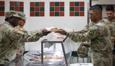 Soldier serves lunch to at the Muleskinner Warrior Restaurant, Fort Drum,