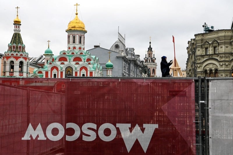 Workers construct an outdoor ice skating rink in Red Square in downtown Moscow on Nov. 9, 2021.