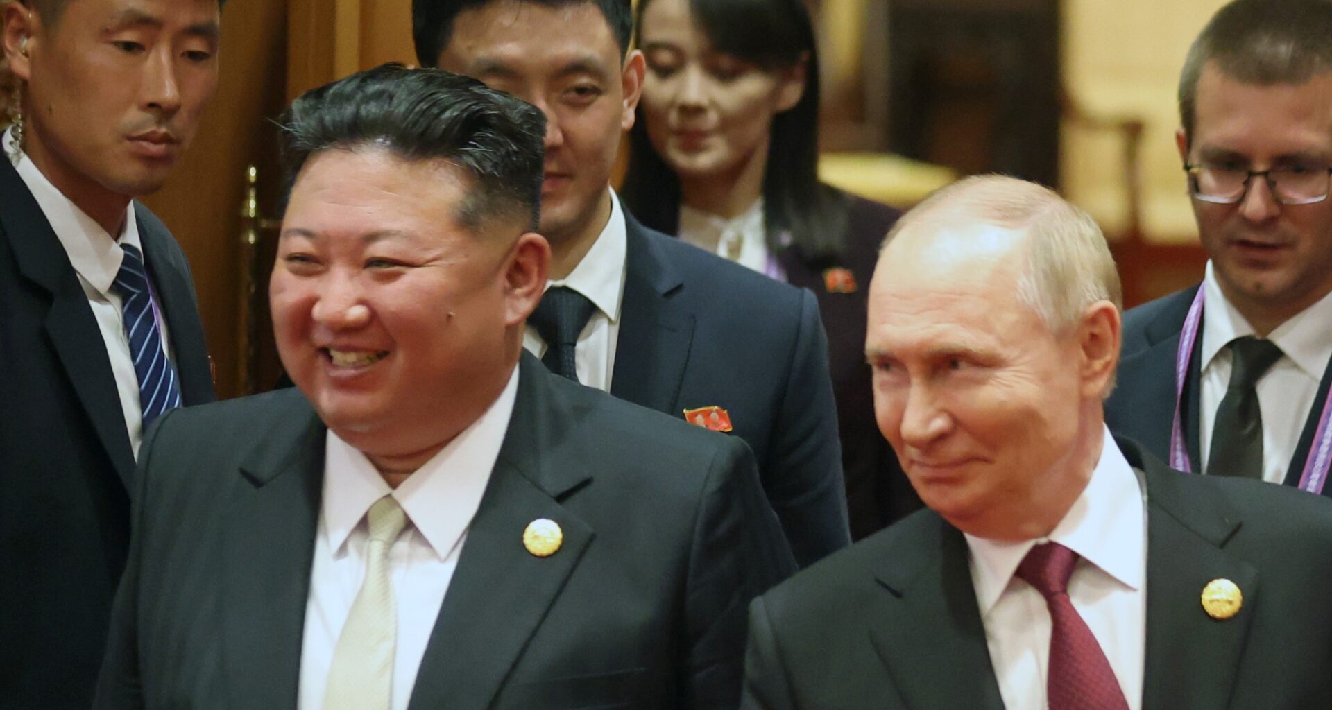Kim Jong Un and Vladimir Putin walk side by side