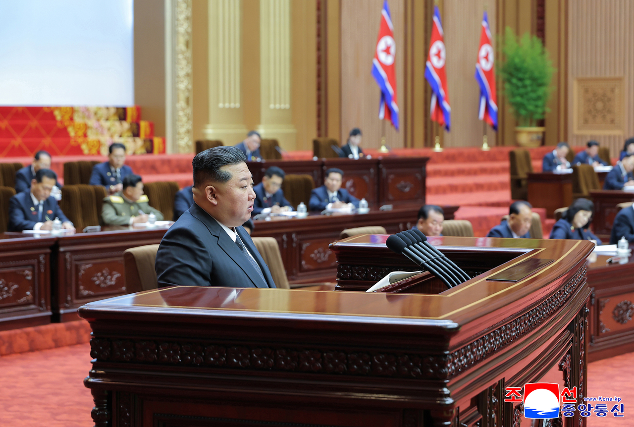 North Korea's leader Kim Jong-un (front) delivers his speech during a session of the Supreme People's Assembly, the country's parliament, at Mansudae Assembly Hall in Pyongyang, on Sunday released by North Korea's official Korean Central News Agency on Monday.