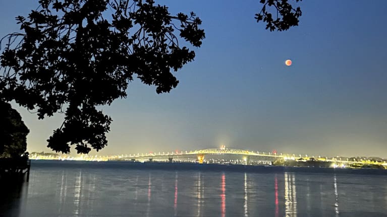 Photo taken of the moon over the Auckland Harbour Bridge from Devonport.