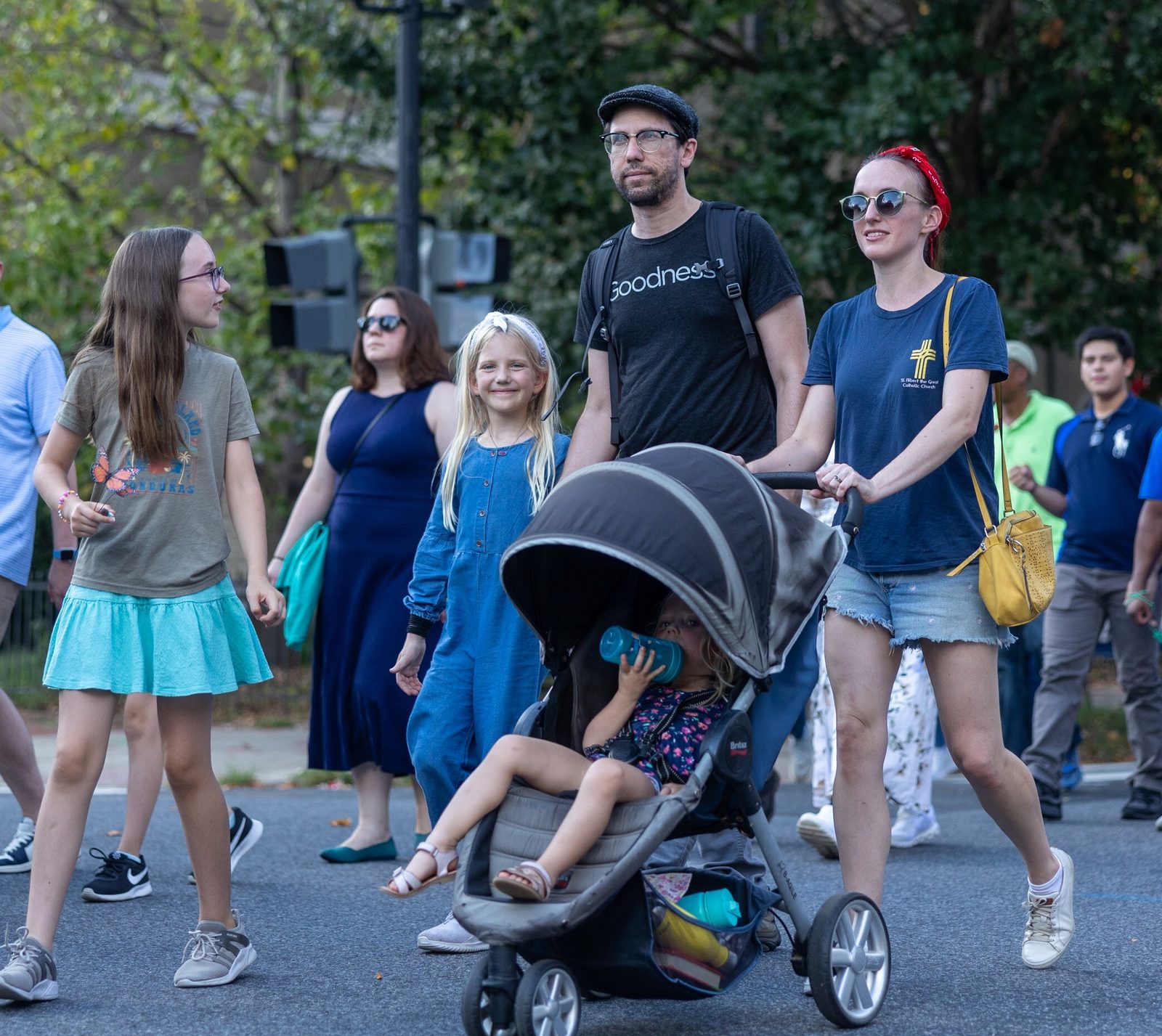People walk in a procession for the 111th World Day of Migrants and Refugees on Sept. 28, 2025 that began at the Shrine of the Sacred Heart in Washington, D.C., wound down 16th Street, and concluded at the Cathedral of St. Matthew the Apostle. (Catholic Standard photos by Mihoko Owada)