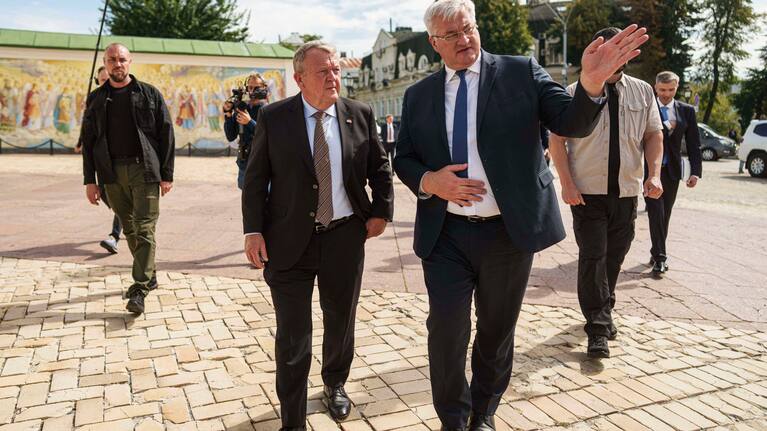 Denmark's Foreign Minister Lars Lokke Rasmussen, left, and Ukraine's Foreign Minister Andrii Sybiha, right, walk in center of Kyiv, Ukraine, on Friday, Sept. 12, 2025.