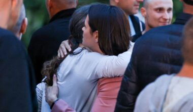 Belarusian opposition leader Sviatlana Tsikhanouskaya welcomes freed prisoners, as they arrive at the US embassy in Vilnius. Pic: Reuters
