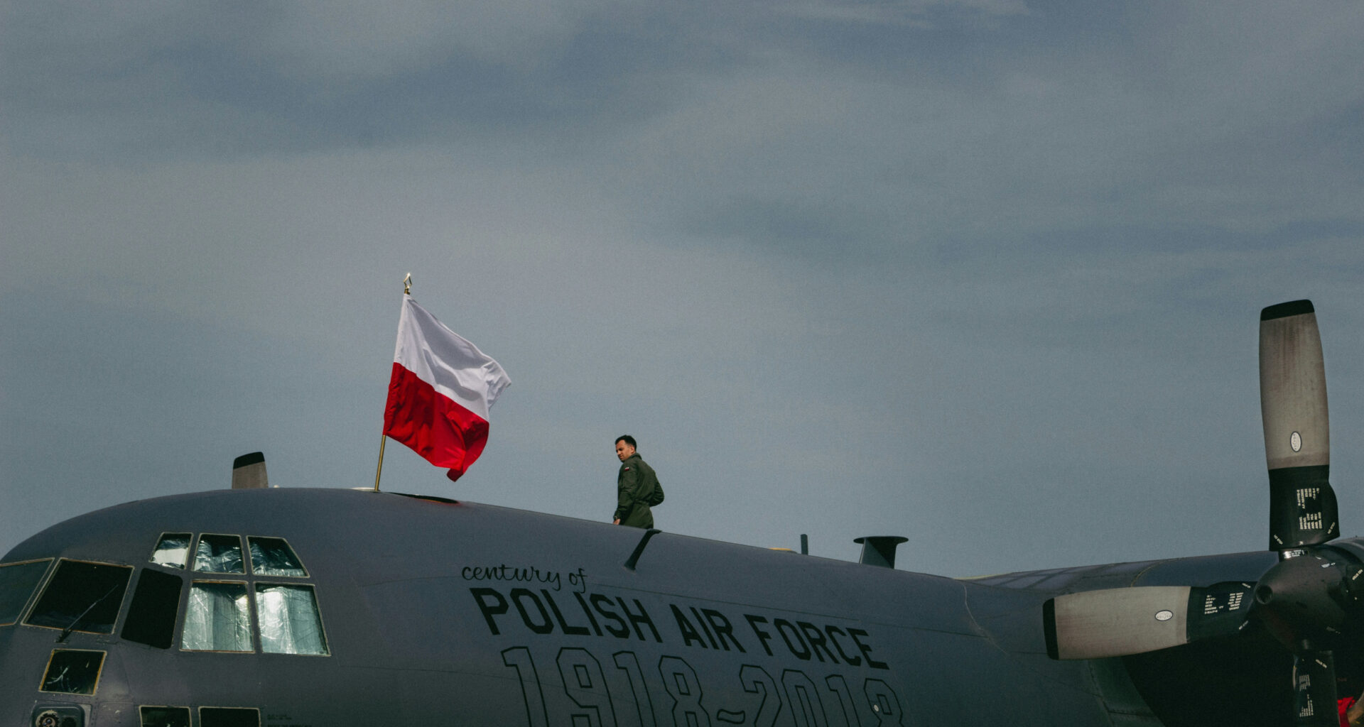 A soldier standing on top of a polish air force