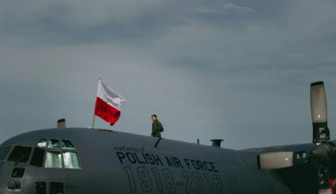 A soldier standing on top of a polish air force